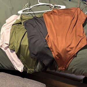 Set of Four Bodysuits in Brown, Black, Green, and Cream